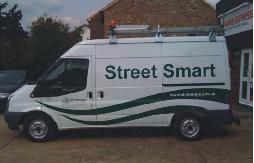 Van with sign saying Street Smart written on the side.